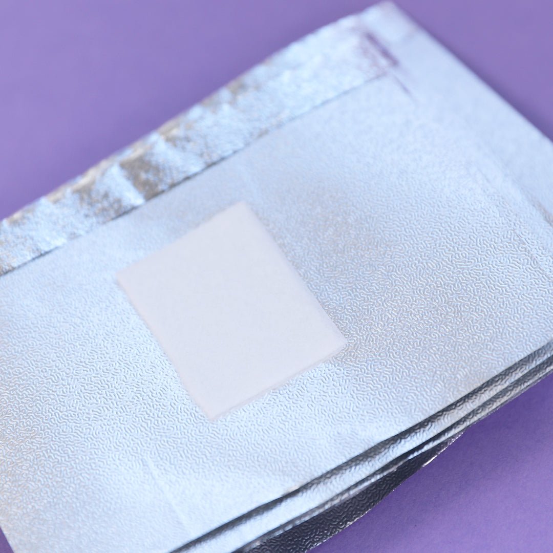 A storage box containing 120 pieces of foil nail art soak off remover wraps, showcasing a compact and organised design for convenient use in nail care diy nails and nail salons