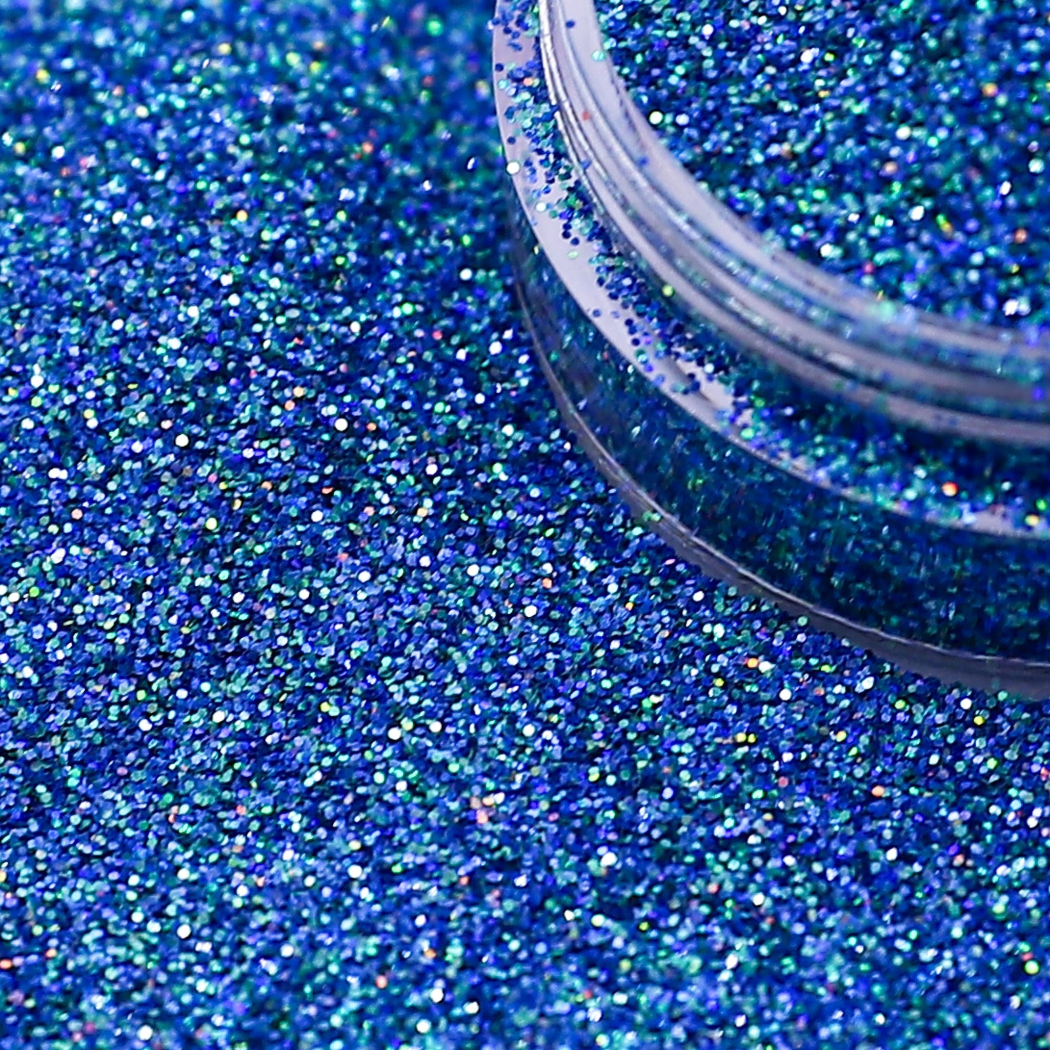 Blue glitter with a container on a blue glitter background