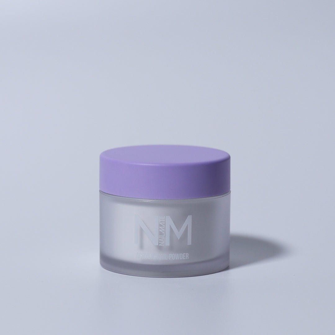 A pot of clear acrylic nail powder with a purple lid, labeled &