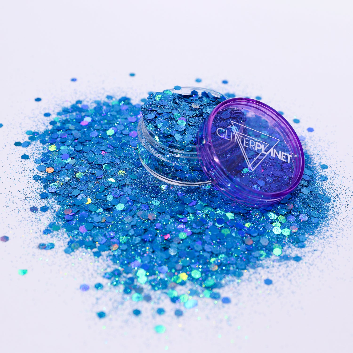 Blue glitter with a purple lid labeled &