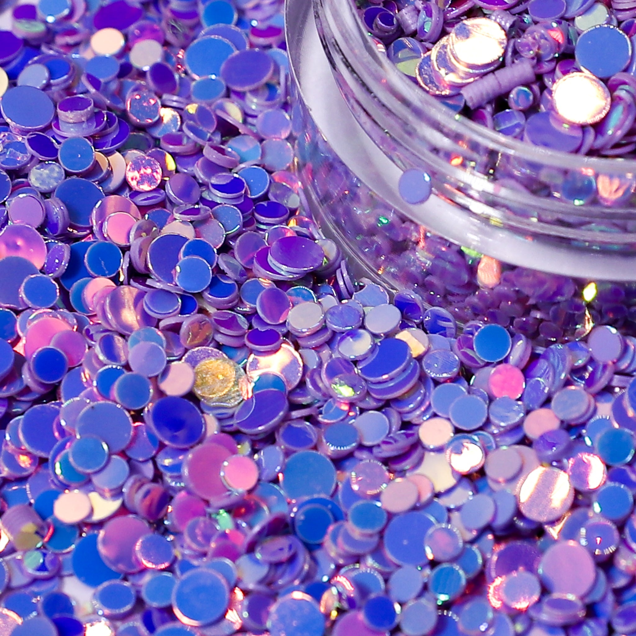 Purple\lilac round sequins in a clear container