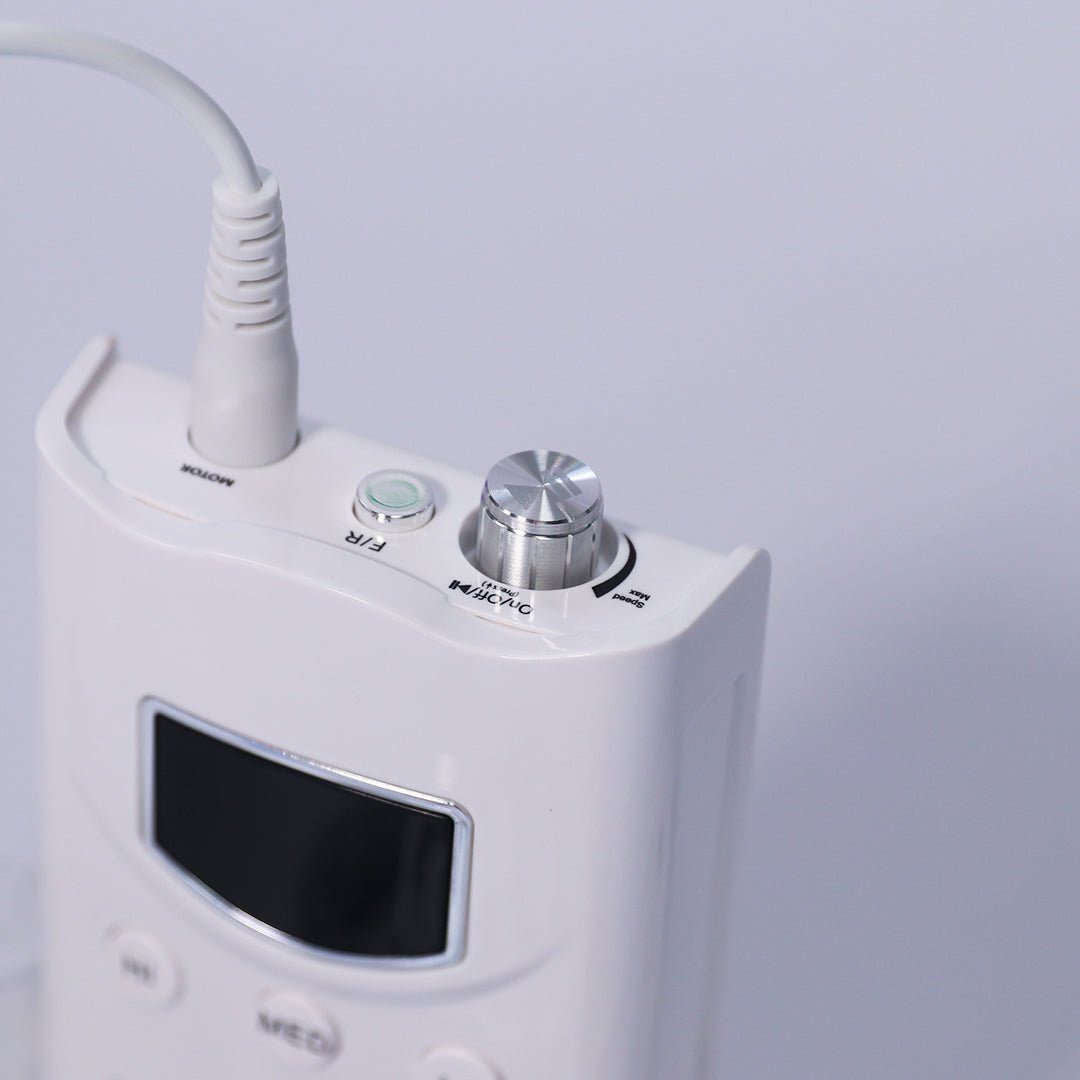 A white rechargeable nail drill machine with a lilac hand piece, designed for professional nail care. The machine features a compact design, with a digital display and control buttons on the front, showcasing its sleek appearance on a soft white background. it has speeds of 35,000 rpm and a torque of 4.8