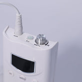 A white rechargeable nail drill machine with a lilac hand piece, designed for professional nail care. The machine features a compact design, with a digital display and control buttons on the front, showcasing its sleek appearance on a soft white background. it has speeds of 35,000 rpm and a torque of 4.8