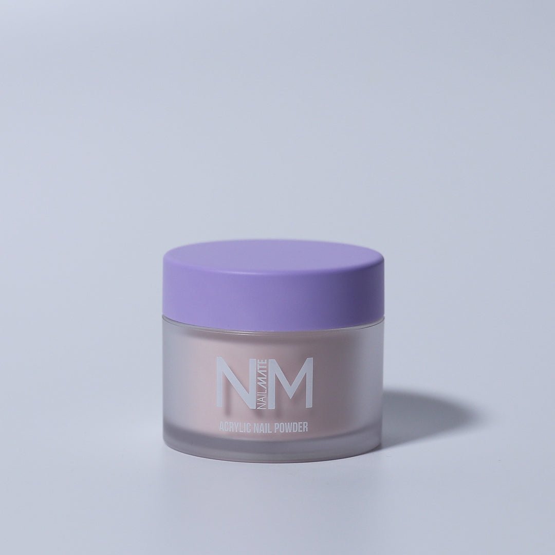 A container of Nude Attitude Acrylic Core powder with a purple lid, branded with NM.