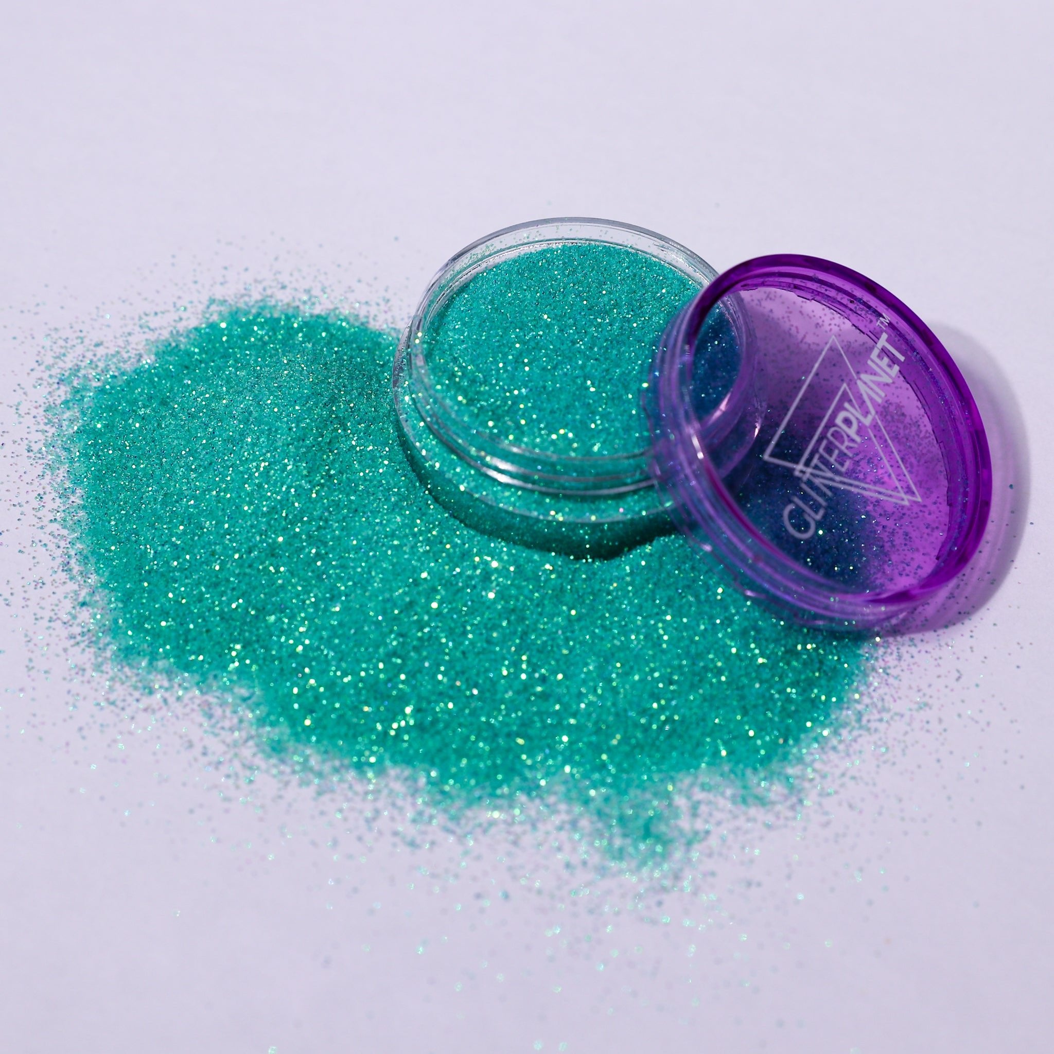 Paradise turquoise nail glitter in a pot branded with GLITTER PLANET
