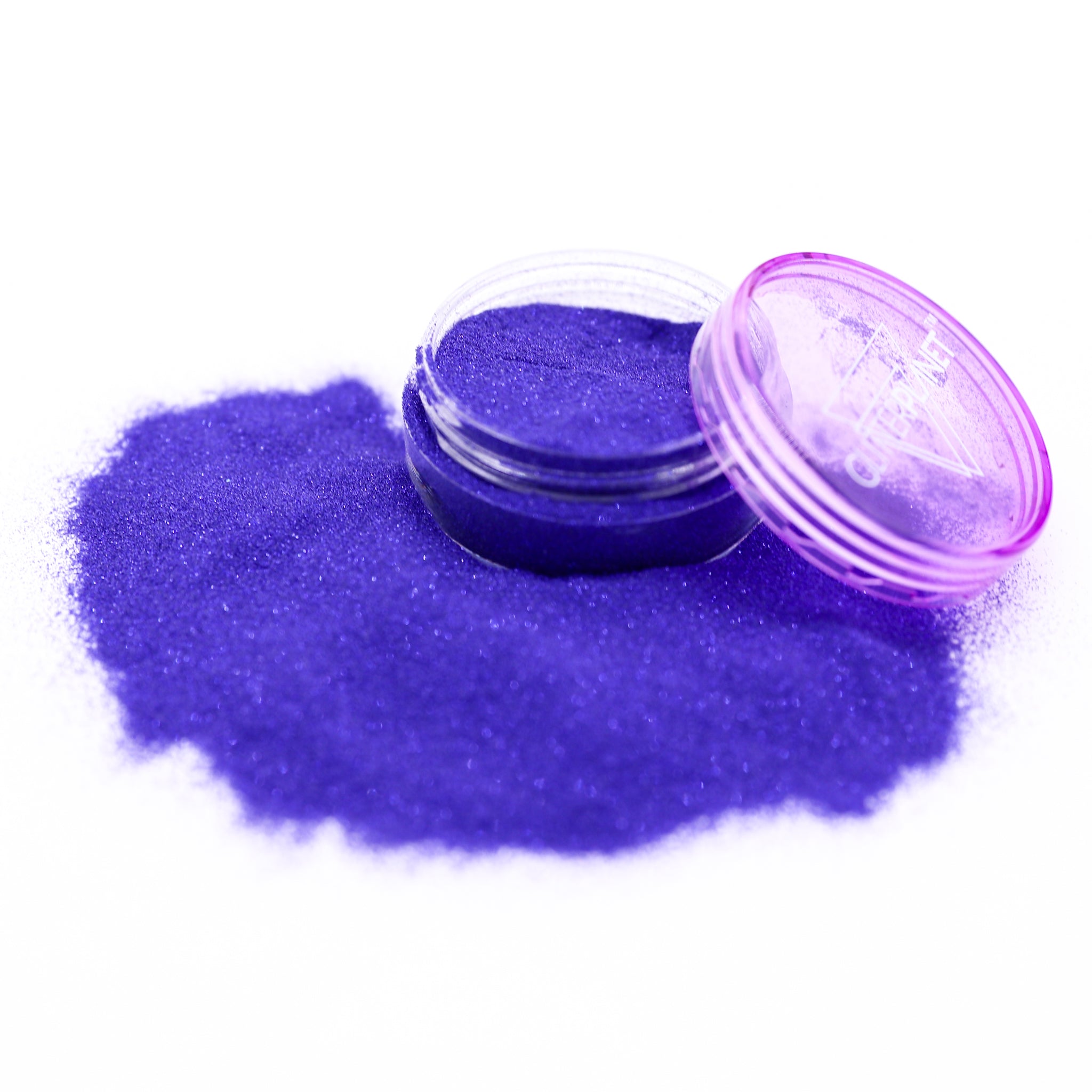 navy glitter powder in a small open container on a white background