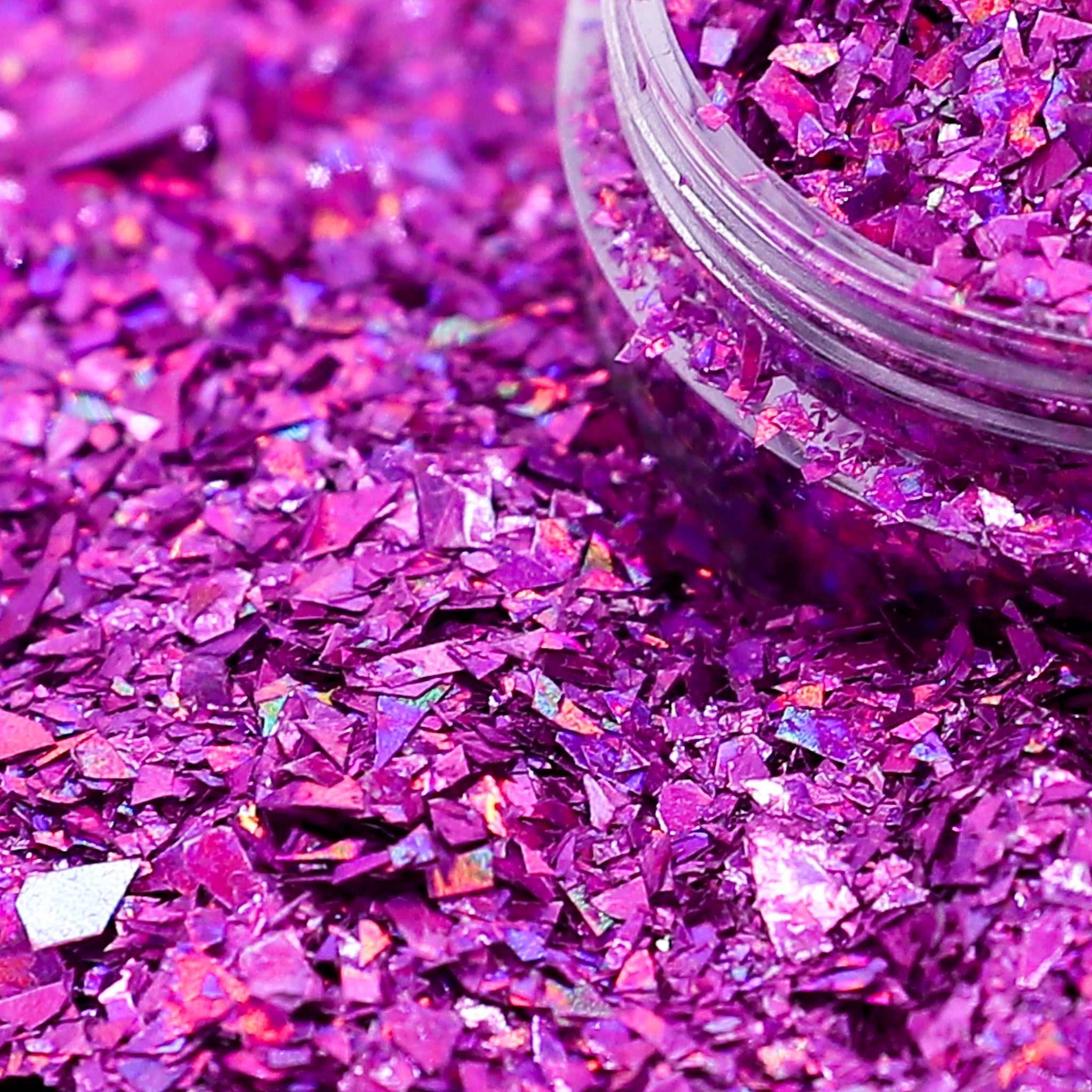 pink glitter with a clear container on a pink glitter background