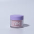 A container of Pirouette shimmer core acrylic nail powder in light pink color with a purple lid, branded with NM.