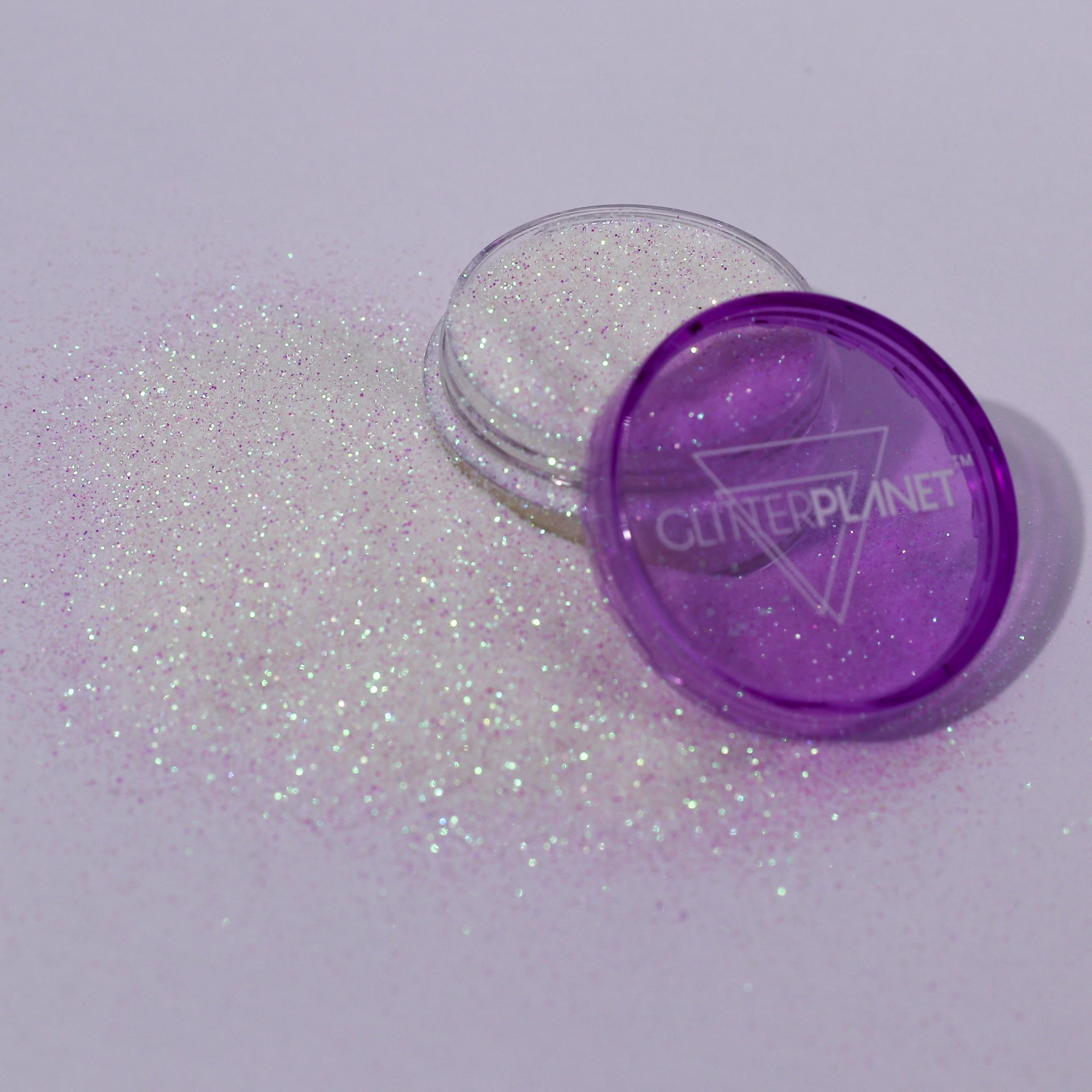 white pink glitter container with open lid on a white background