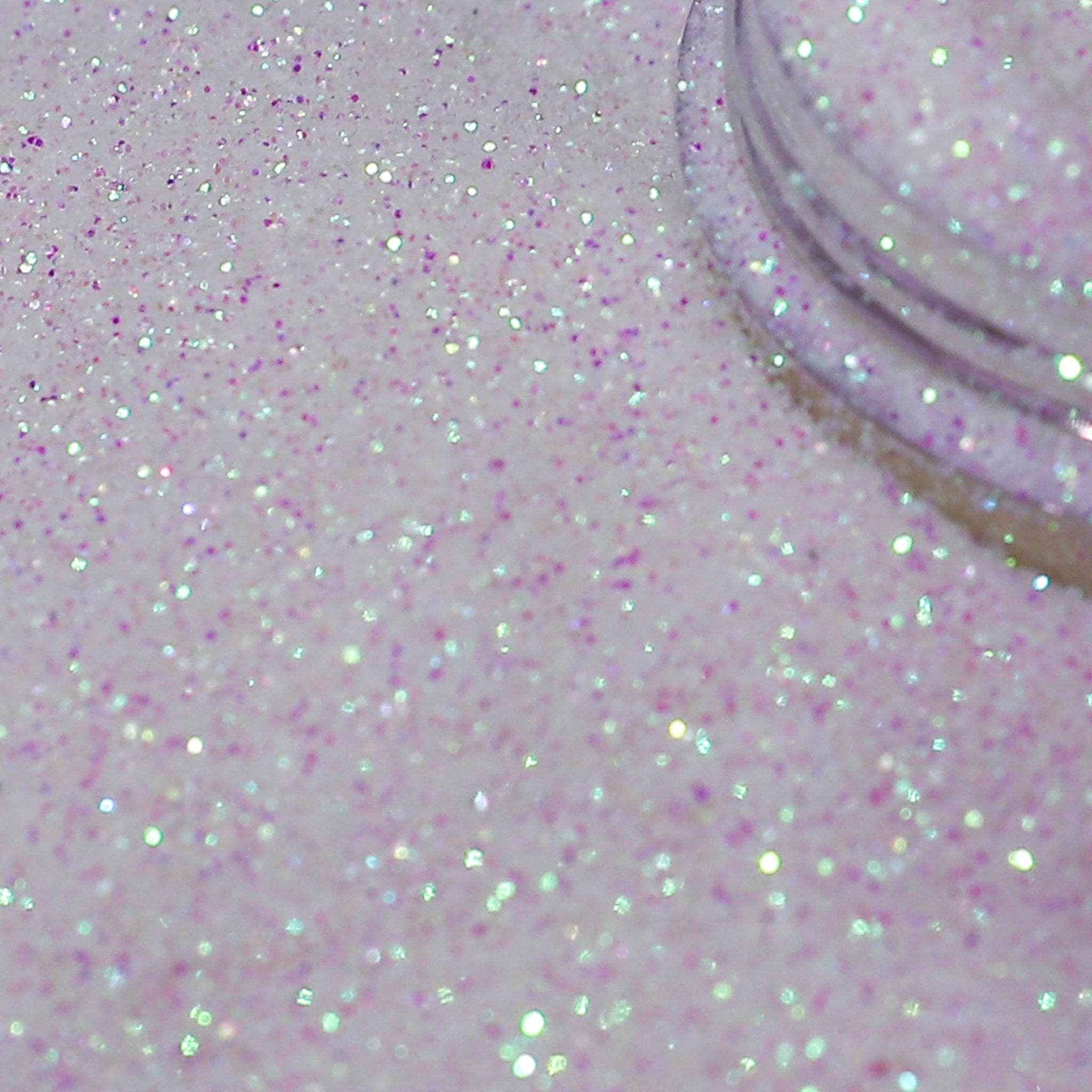 Close-up of white pink glitter on a white background