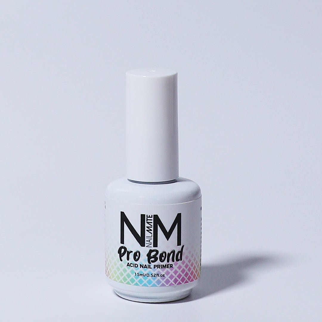 A bottle of Pro Bond acid nail primer by Nail Mate, with a white cap and label that includes the brand name and product description.