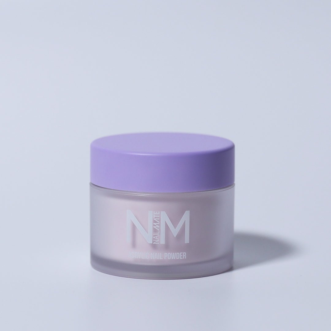 A container of Soft White Acrylic Nail Powder with a purple lid, labeled NM on a plain background.