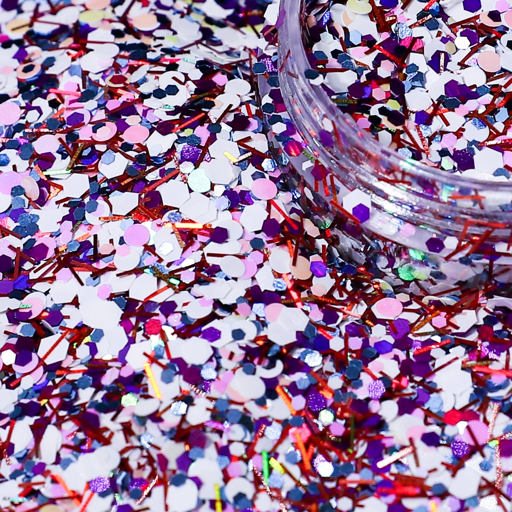 Colorful glitter with a jar of glitter on a multicolored background