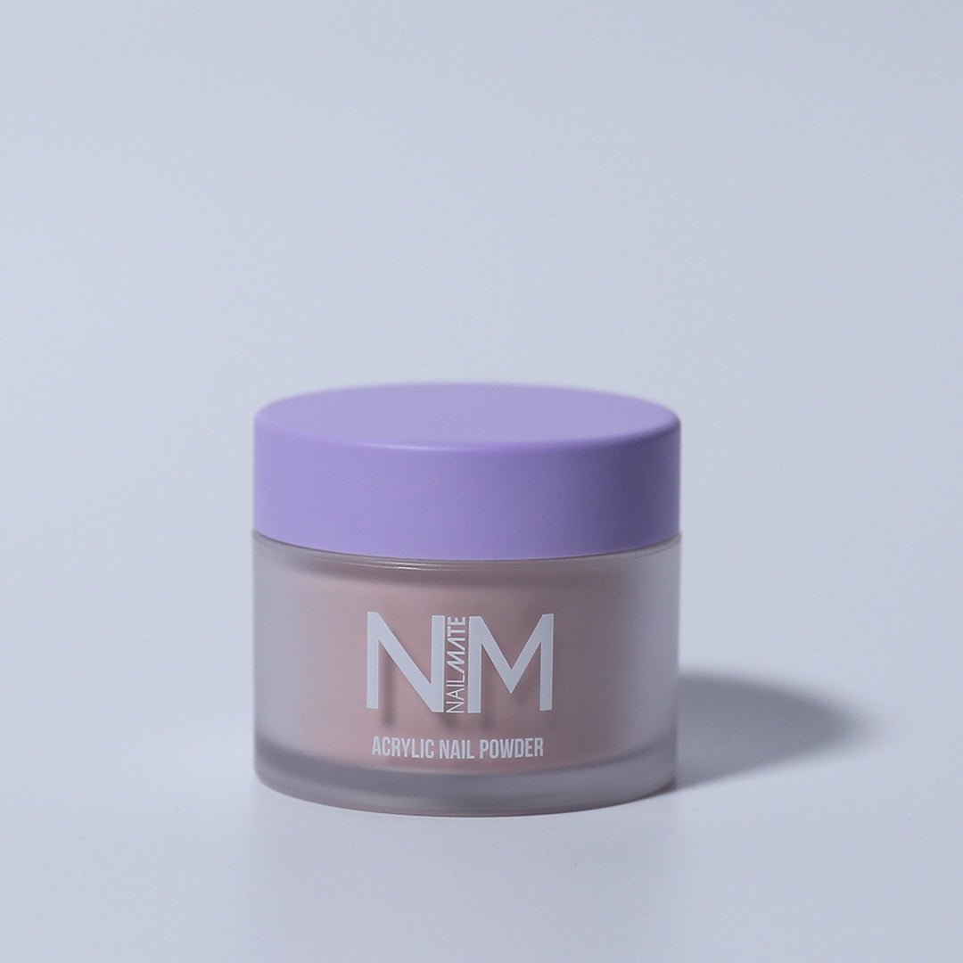A container of Warm Beige acrylic nail powder with a purple lid, branded by NM, against a white background.