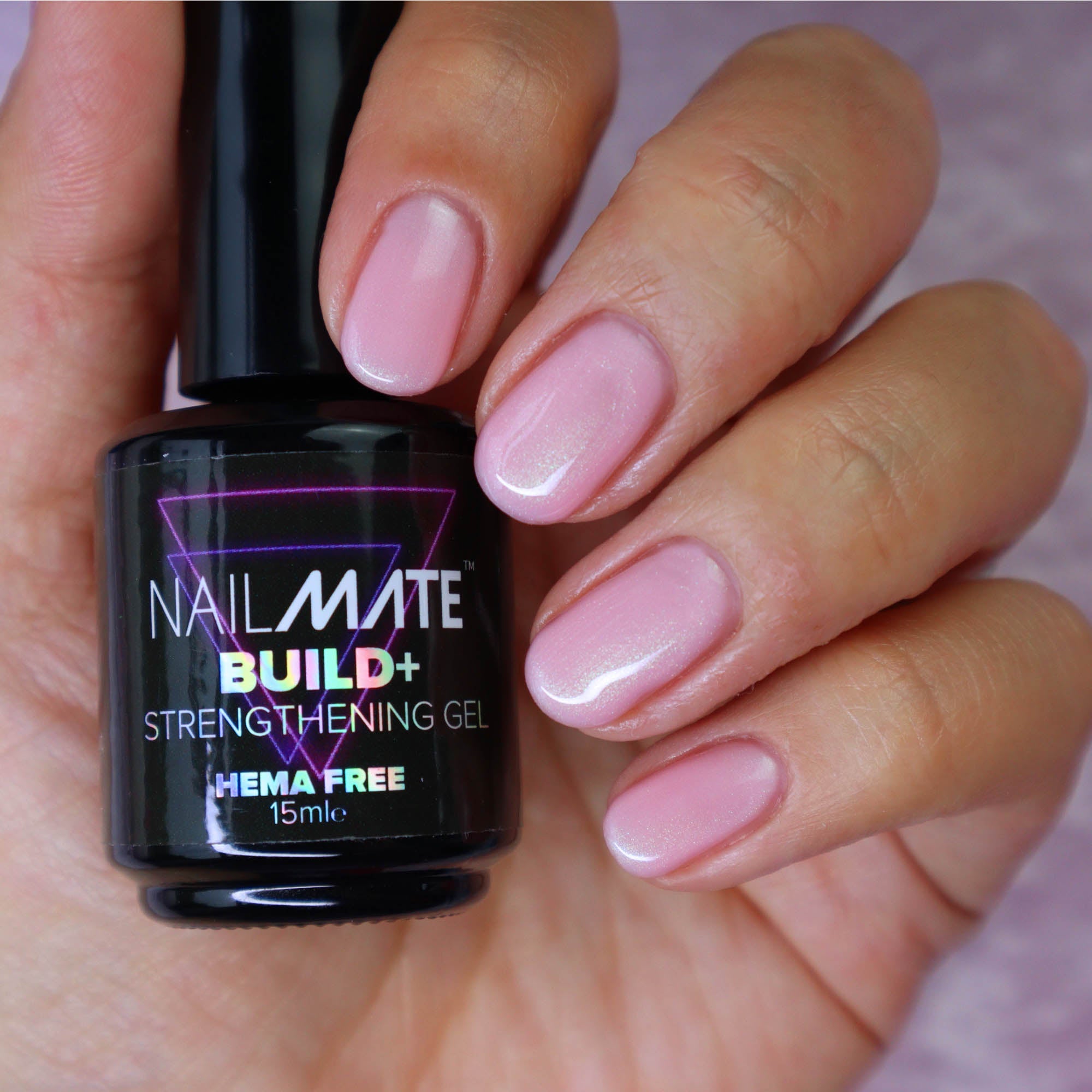 builder gel in a bottle with the gel painted on short length nails