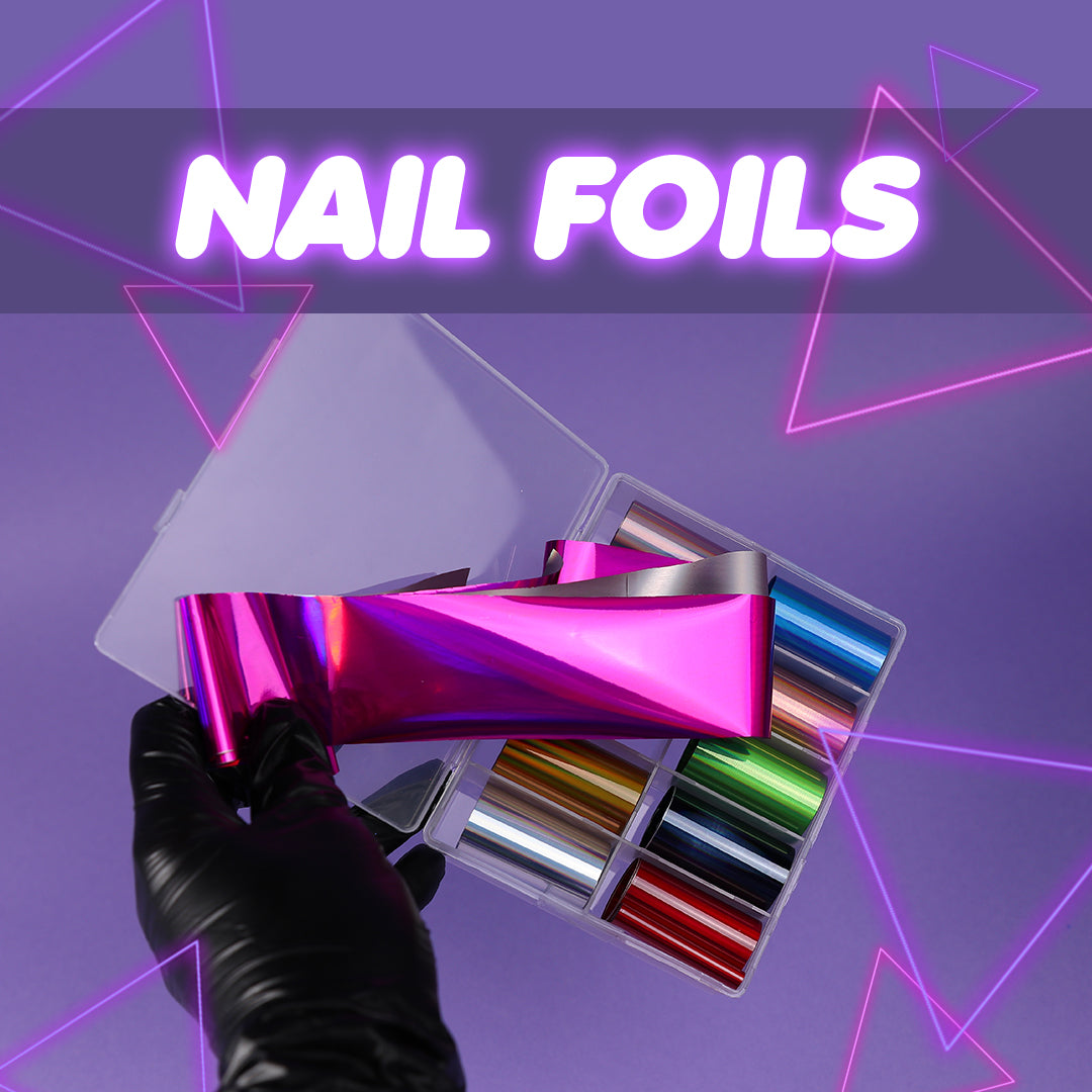 a hand wearing a black medical glove holding a box of metallic nail art transfer foils open to show the colours on a lilac background the text say nail foils