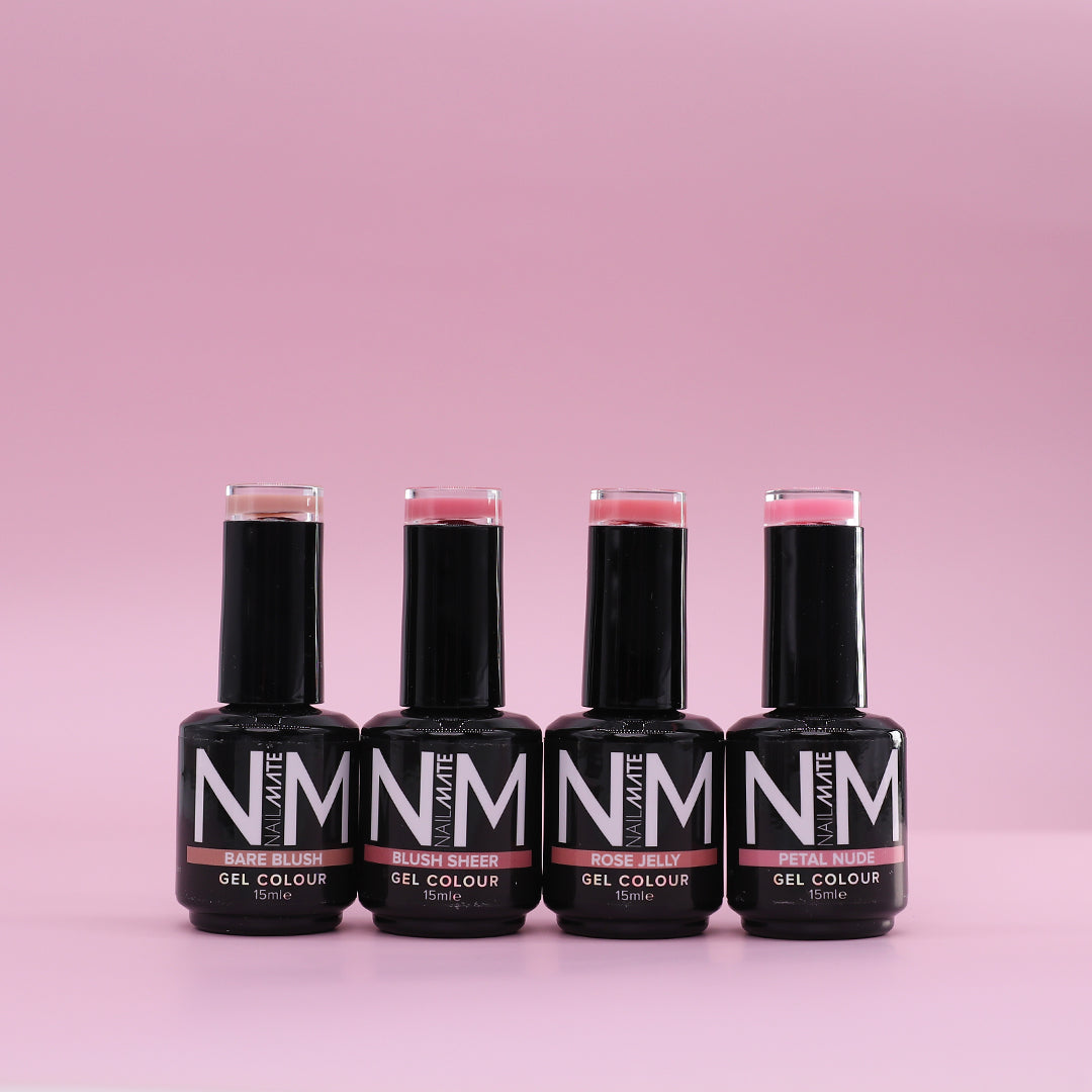 Four bottles of NM Brand gel nail polish in shades of pink, arranged in a row against a solid pink background.