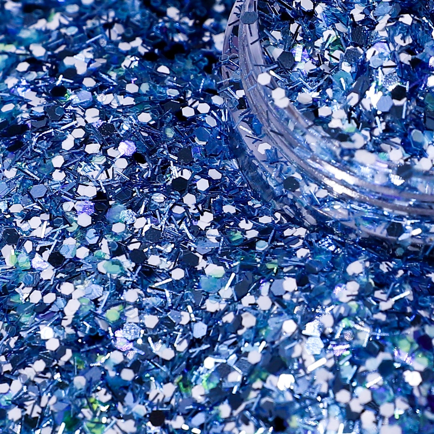 Blue glitter with a clear container on a blue background