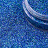 Blue glitter with a container on a blue glitter background