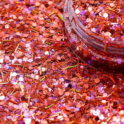 Rose gold/Bronze glitter with a jar partially filled with glitter on a pink background