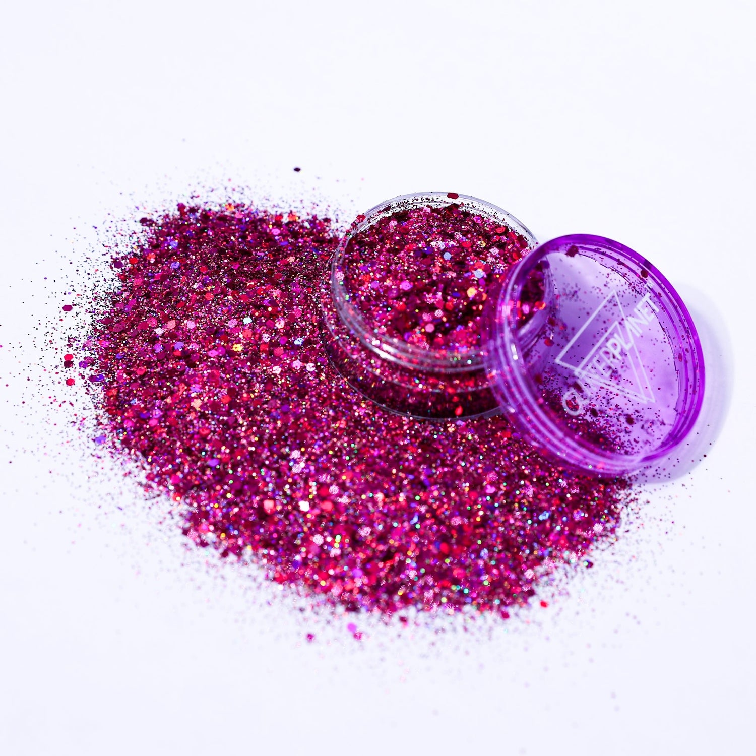 Pink glitter in an open container on a white background
