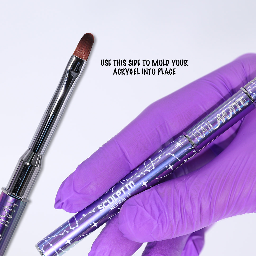 A hand wearing a purple nitrile glove holds a metallic purple acrygel brush tool labeled &