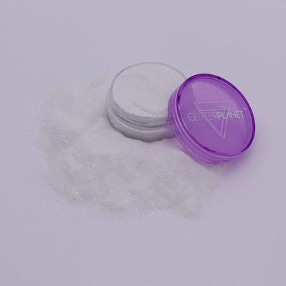 Purple container with white powder on a light gray background