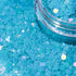 Turquoise glitter with a clear container partially filled with glitter