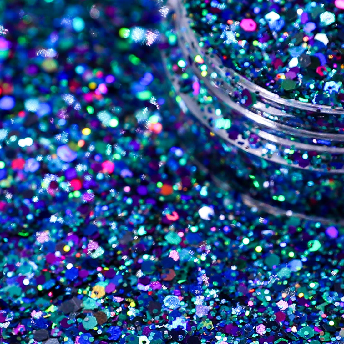 galaxy holographic nail glitter spilling out of jar