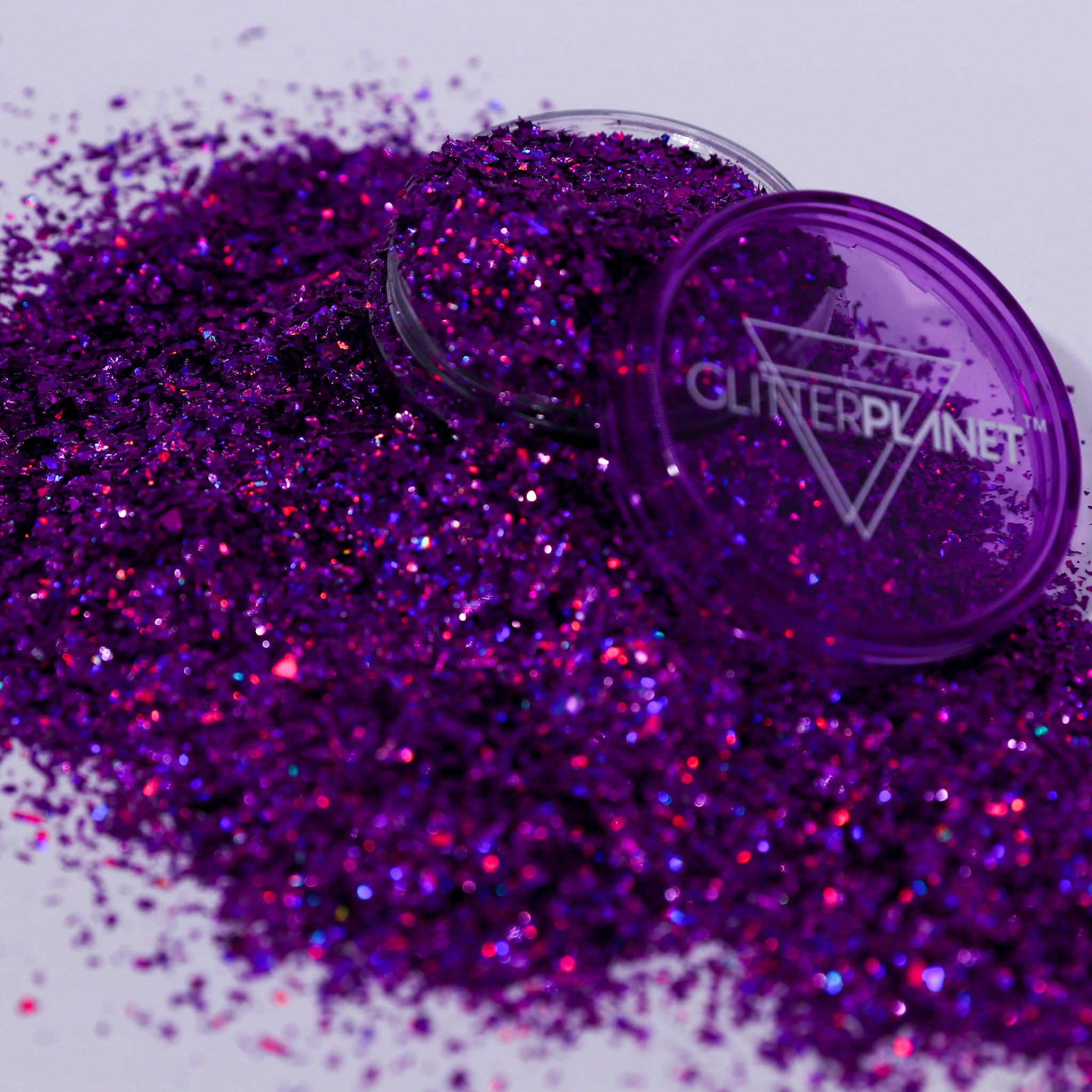 Purple glitter with a container labeled &