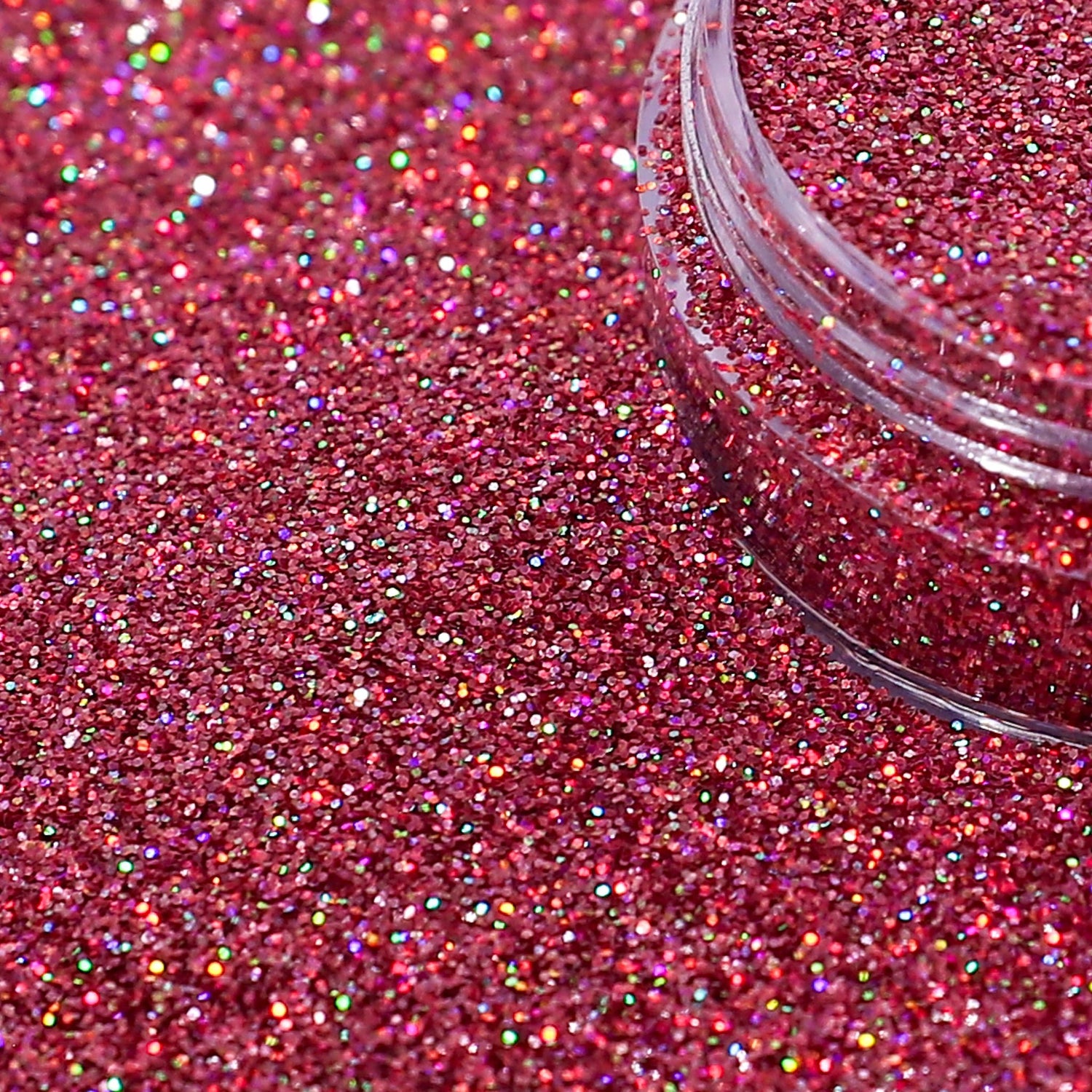 Close-up of Rose Pink glitter with a clear container partially filled with glitter.