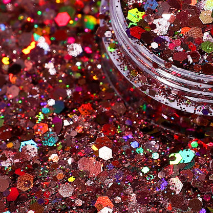 Close-up of multicolored glitter with a jar partially filled with glitter.