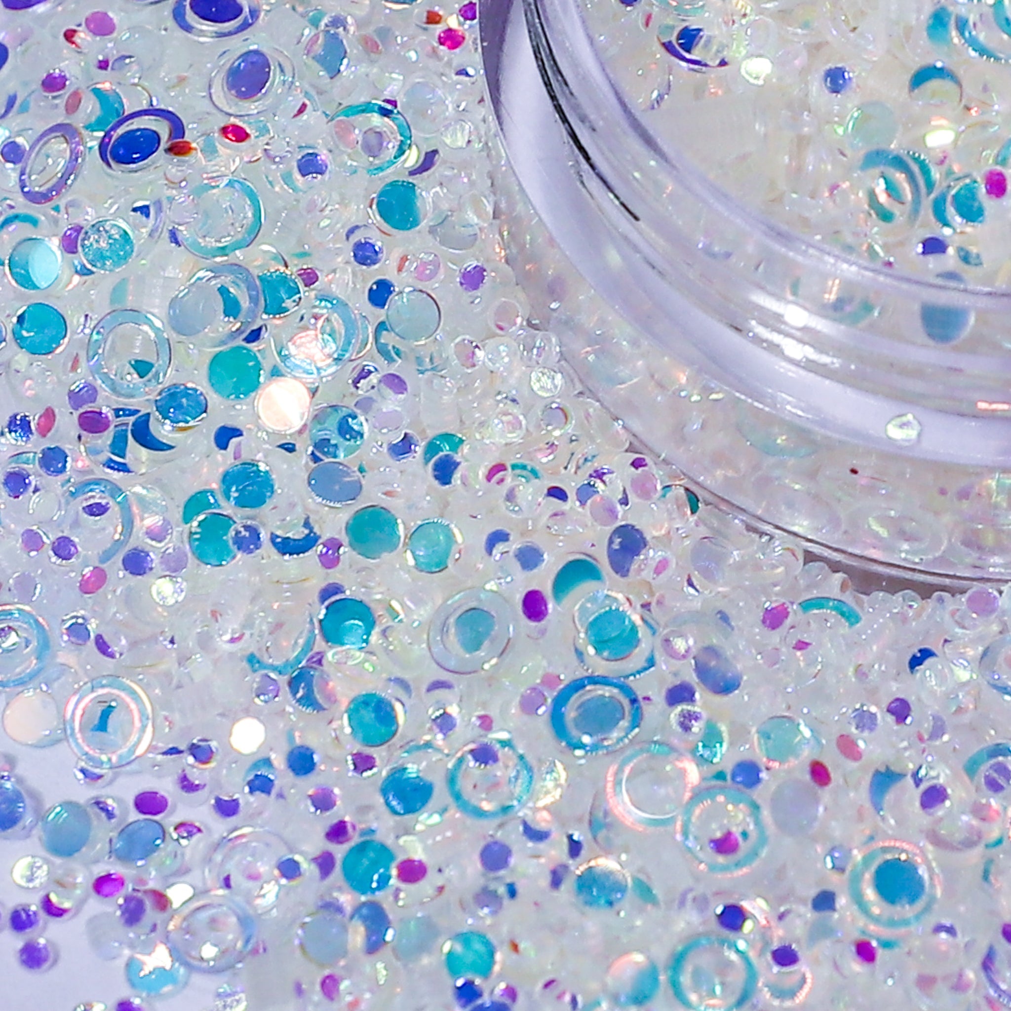 Colorful glitter with a jar on a white background