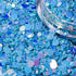 Blue glitter with a clear container on a blue background