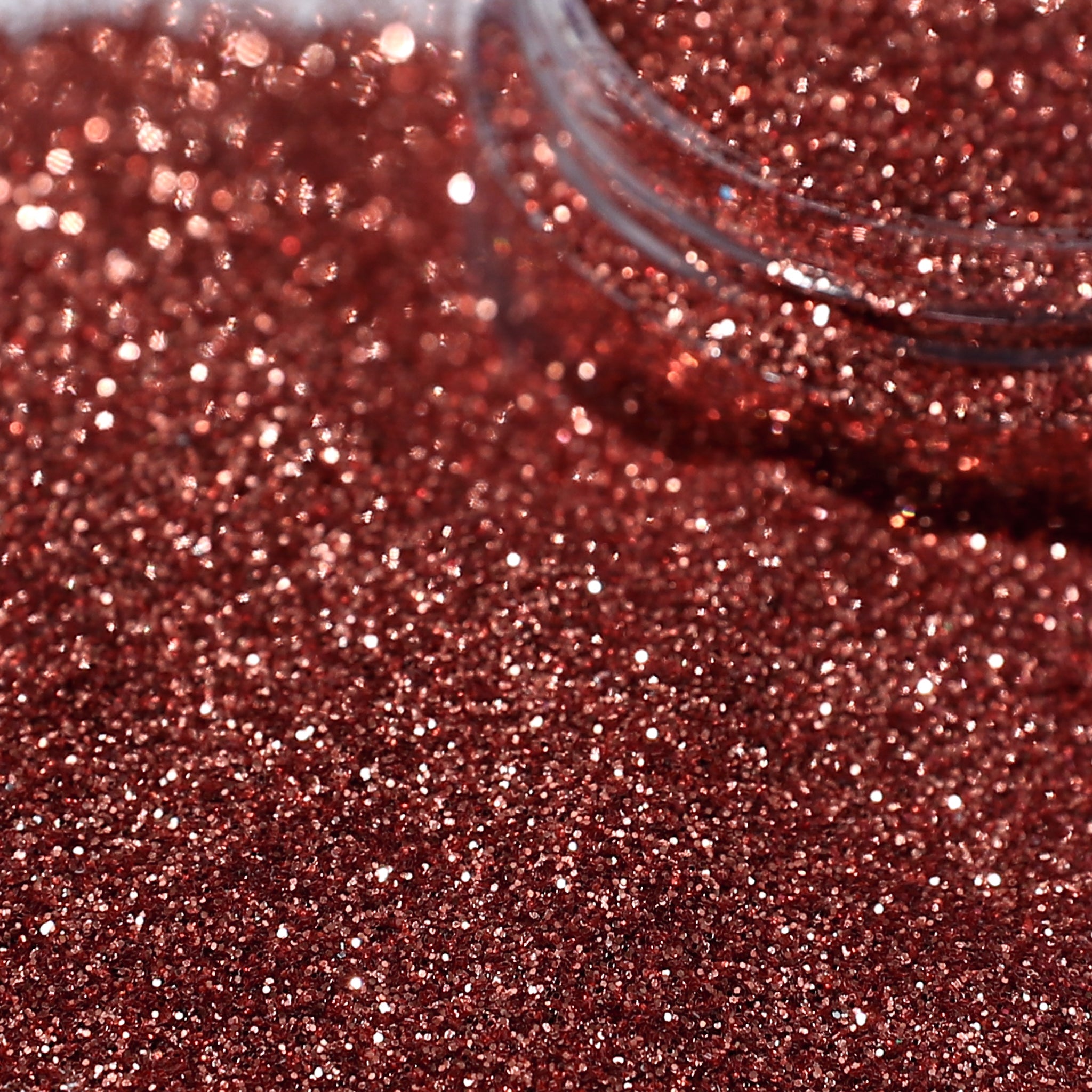 Close-up of caramel glitter with a clear container.
