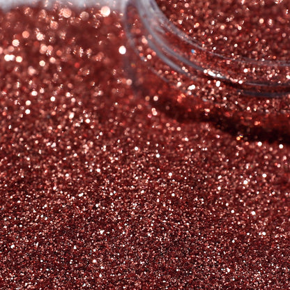 Close-up of caramel glitter with a clear container.