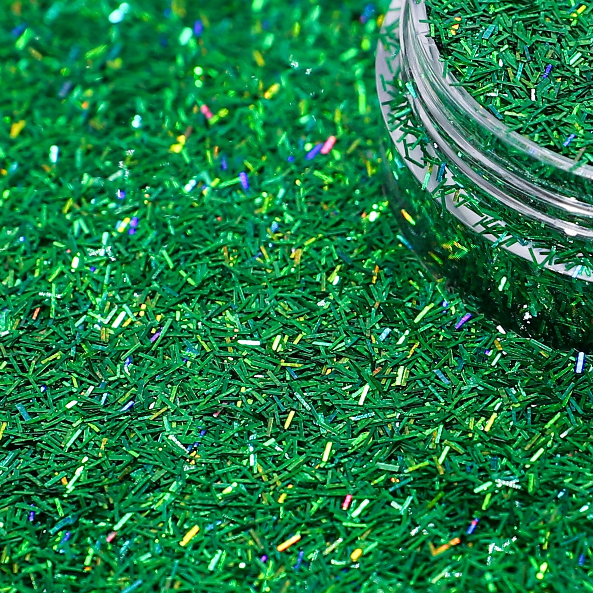 Green glittery sprinkles with a clear jar in the background