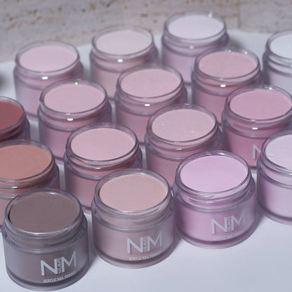Multiple jars of pink powder with &