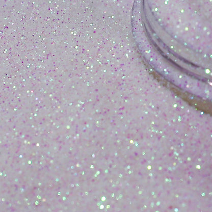 Close-up of white pink glitter on a white background