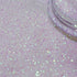 Close-up of white pink glitter on a white background