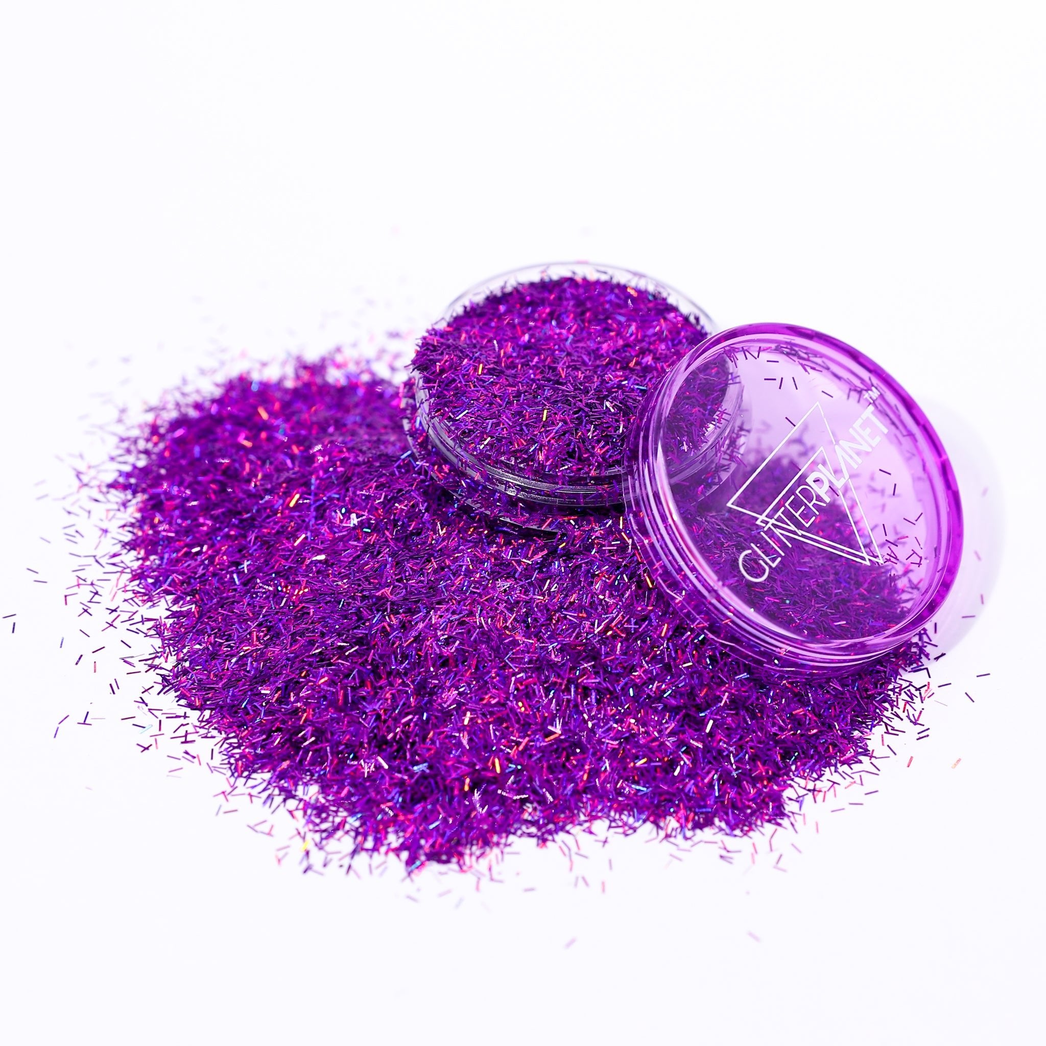 Purple glitter with a clear container on a white background