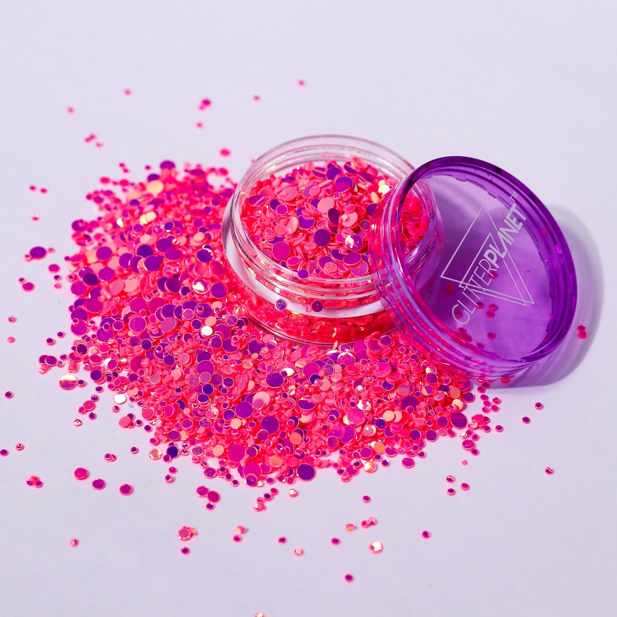 pink iridescent dot nail glitter on a white background