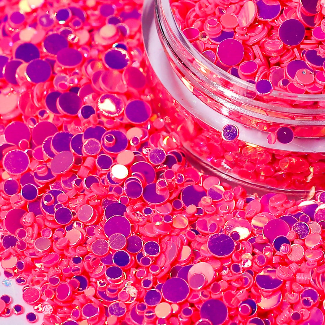 Pink iridescent dot nail glitter close up