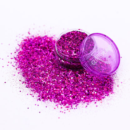 Purple glitter with an open container on a white background