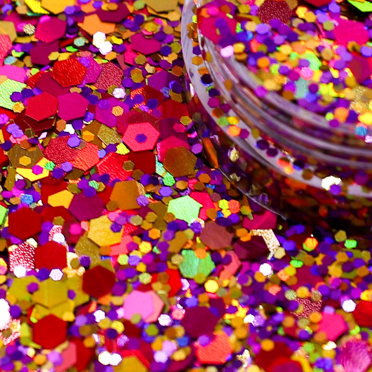Colorful glitter with a clear container on a multicolored background