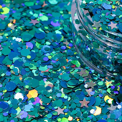 Turquoise glitter with star shapes on a blue background