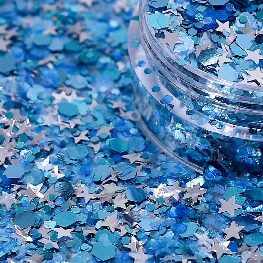 Blue and silver star-shaped confetti with a clear container.