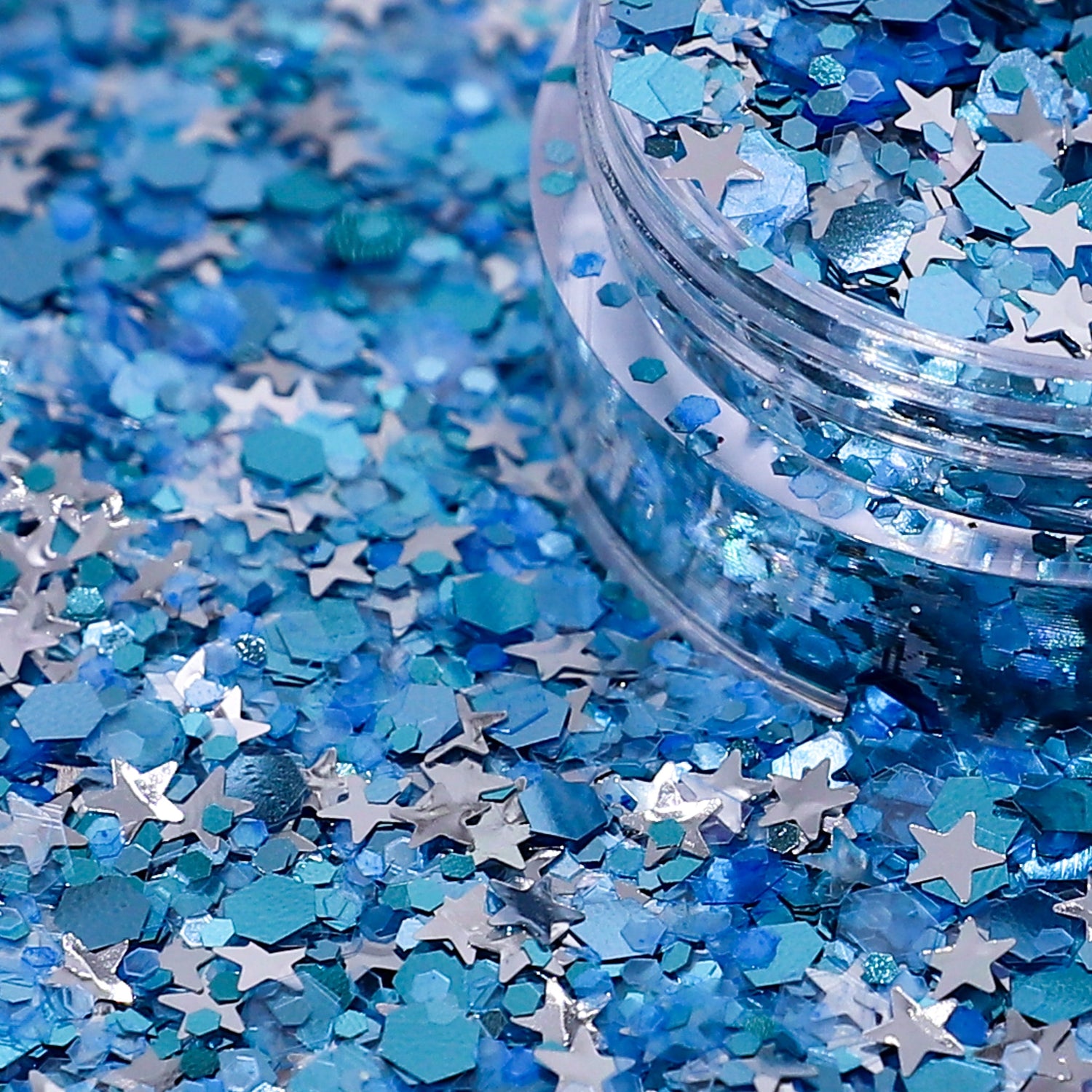 Blue and silver star-shaped confetti with a clear container.