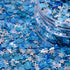Blue and silver star-shaped confetti with a clear container.