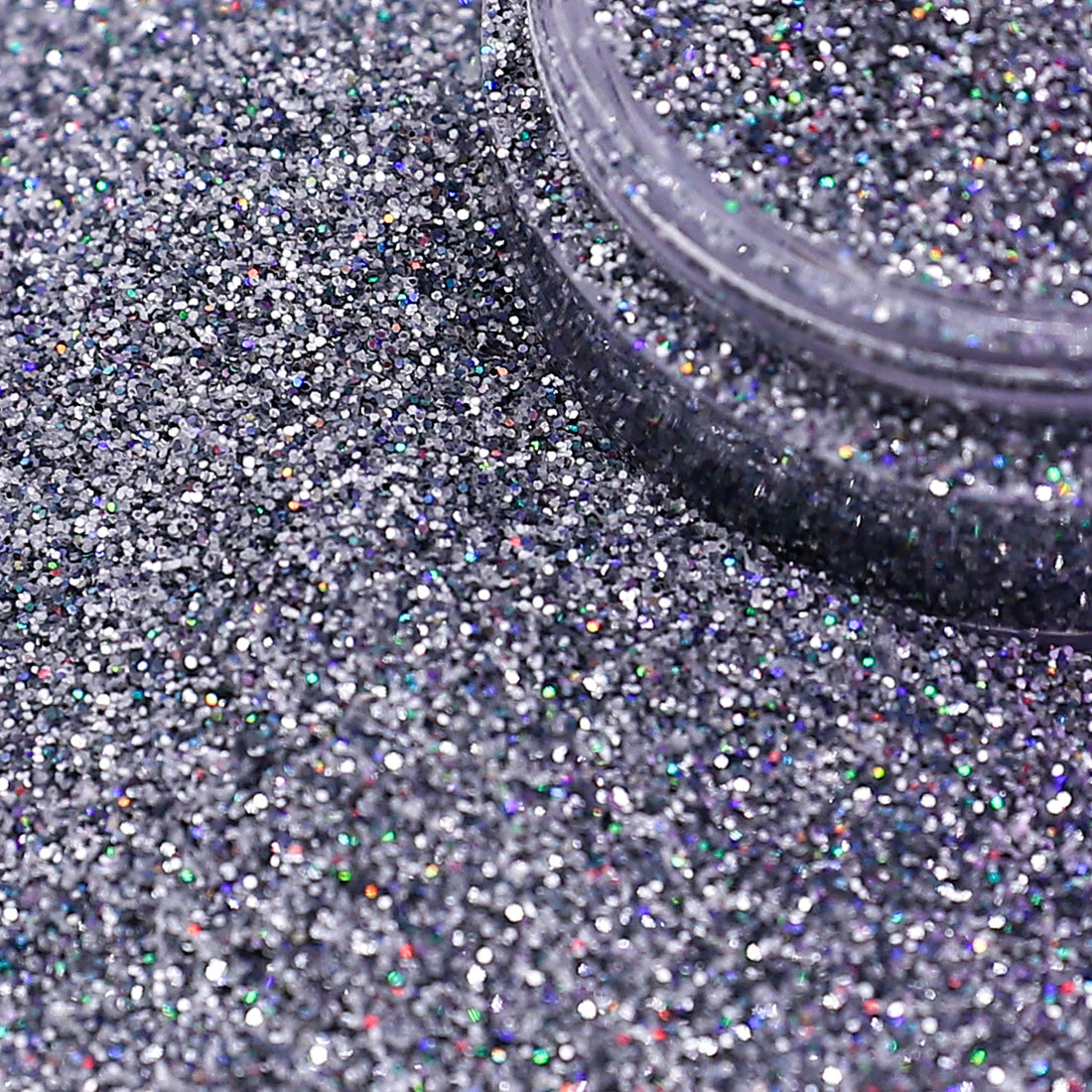 Silver glitter with a container on a textured surface